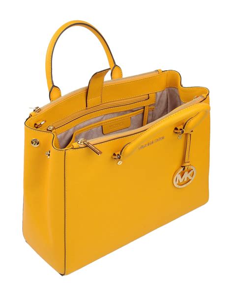 michael kors yellow studded wallet|Michael Kors yellow shoulder bag.